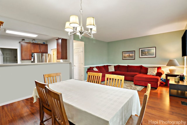 5208 Cobblers Xing Unit 5208, Mchenry, IL 60050 - dining room featuring wood finished floors and a chandelier