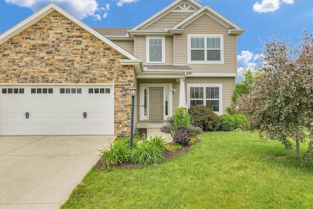 2107 Max Run Dr E, Champaign, IL 61822 - view of front facade featuring stone siding, a front lawn, driveway, and an attached garage