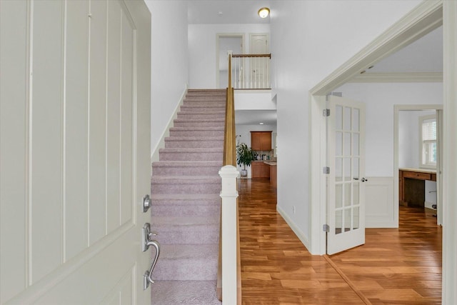 2107 Max Run Dr E, Champaign, IL 61822 - entryway featuring light wood-style flooring, stairway, and ornamental molding