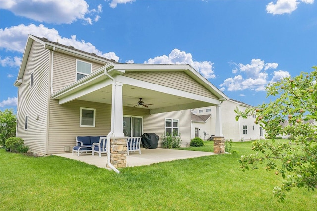 2107 Max Run Dr E, Champaign, IL 61822 - back of house with a ceiling fan, a patio area, and a lawn