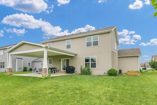 2107 Max Run Dr E, Champaign, IL 61822 - back of house featuring a patio and a yard