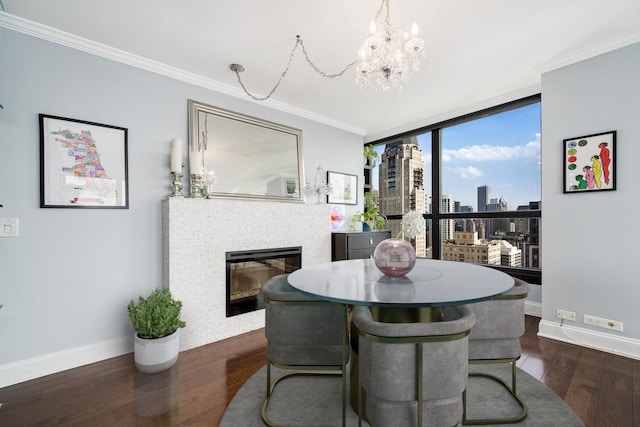 1030 N State St Unit 44L, Chicago, IL 60610 - dining area with crown molding, wood finished floors, a chandelier, a glass covered fireplace, and a view of skyline