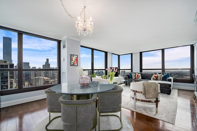 1030 N State St Unit 44L, Chicago, IL 60610 - dining area with a chandelier, wood finished floors, a wall of windows, and a view of city