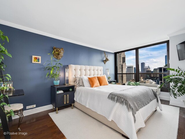 1030 N State St Unit 44L, Chicago, IL 60610 - bedroom featuring wood-type flooring, baseboards, and crown molding