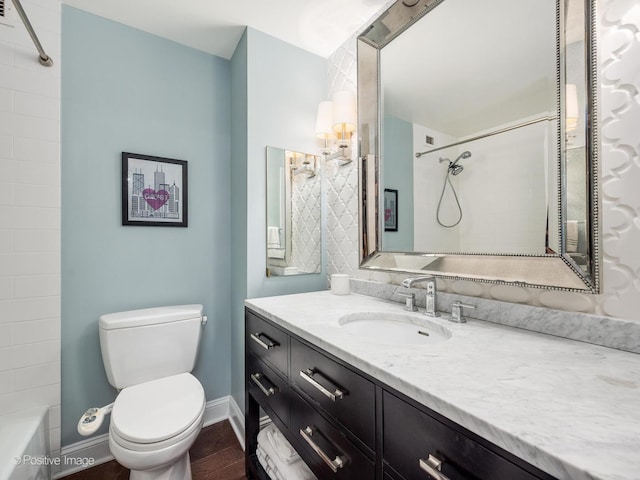 1030 N State St Unit 44L, Chicago, IL 60610 - full bath with toilet, vanity, baseboards, bathing tub / shower combination, and wood finished floors