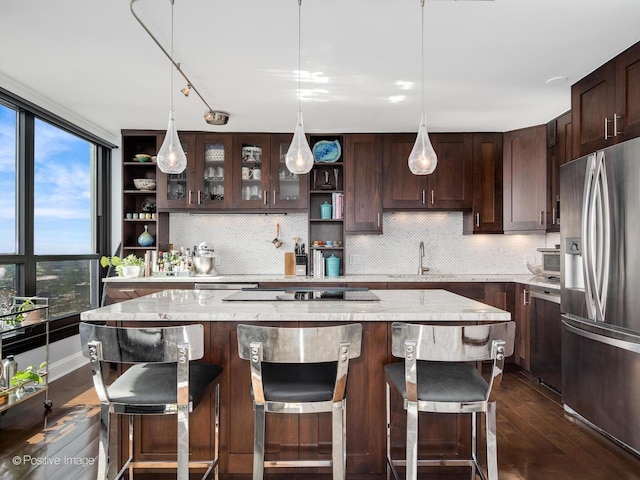 1030 N State St Unit 44L, Chicago, IL 60610 - kitchen with stainless steel refrigerator with ice dispenser, open shelves, dark wood finished floors, dark brown cabinets, and a sink