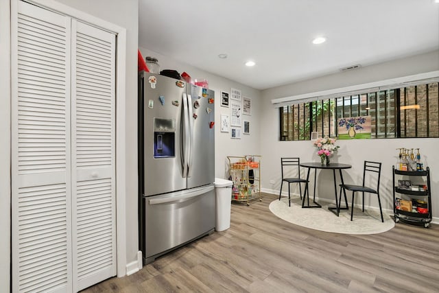 534 W Eugenie St, Chicago, IL 60614 - kitchen featuring stainless steel fridge with ice dispenser, light wood finished floors, and recessed lighting