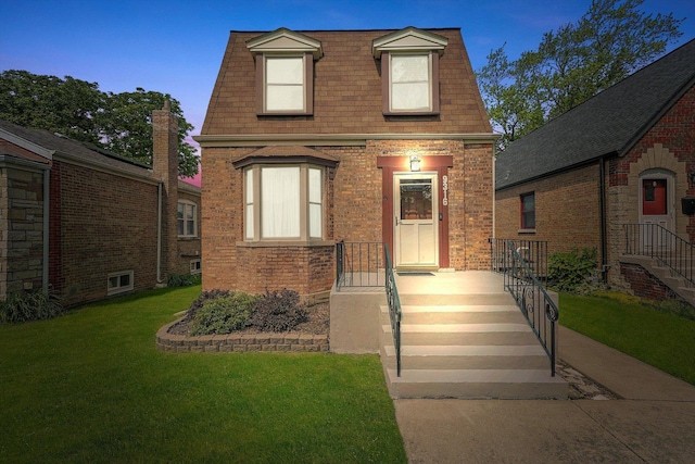 9316 S Utica Ave, Evergreen Park, IL 60805 - view of front of home featuring a front lawn, brick siding, and roof with shingles