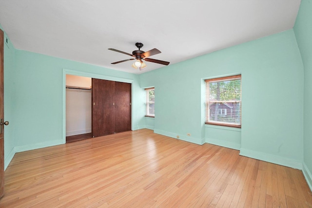 9316 S Utica Ave, Evergreen Park, IL 60805 - unfurnished bedroom with a closet, light wood finished floors, and a ceiling fan