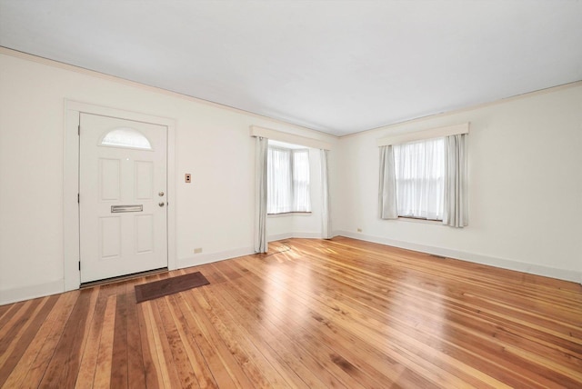 9316 S Utica Ave, Evergreen Park, IL 60805 - entrance foyer featuring healthy amount of natural light, light wood-style flooring, and crown molding