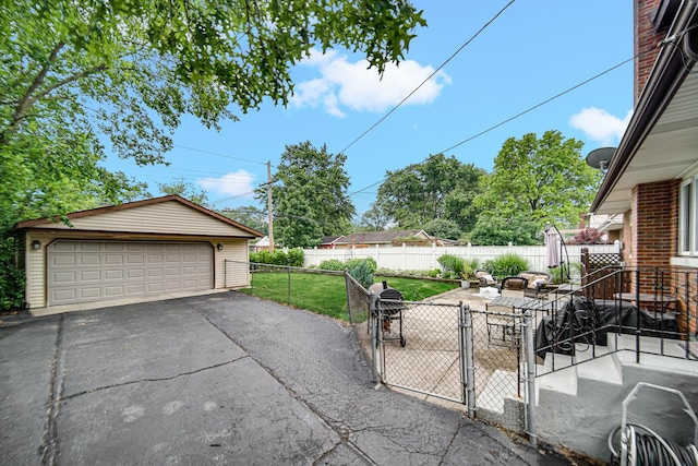 18625 Lexington Ave, Homewood, IL 60430 - view of patio / terrace with a garage, a gate, and an outbuilding