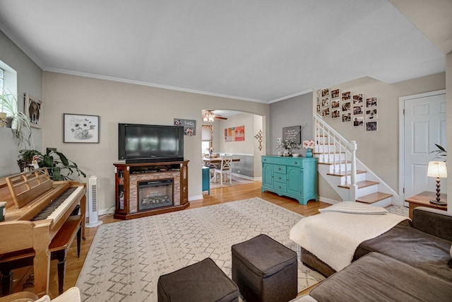 18625 Lexington Ave, Homewood, IL 60430 - living area featuring light wood-style floors, stairs, ornamental molding, and arched walkways