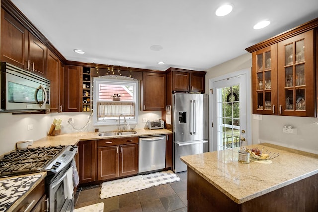 18625 Lexington Ave, Homewood, IL 60430 - kitchen featuring stainless steel appliances, light stone counters, glass insert cabinets, and recessed lighting