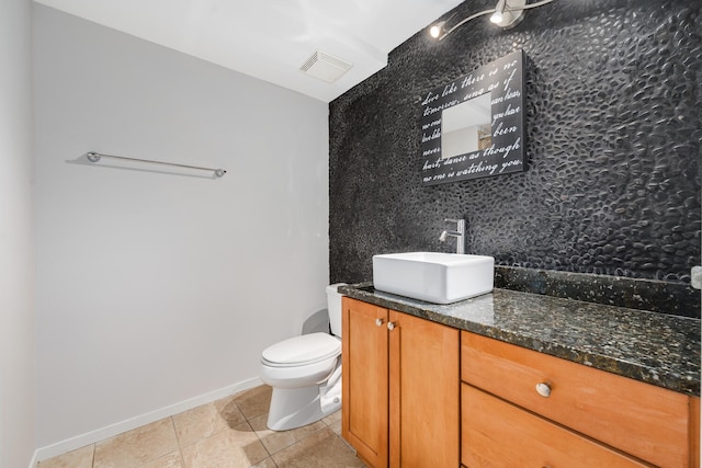 9715 Woods Dr Unit 700, Skokie, IL 60077 - half bathroom with tile patterned floors, vanity, toilet, baseboards, and backsplash