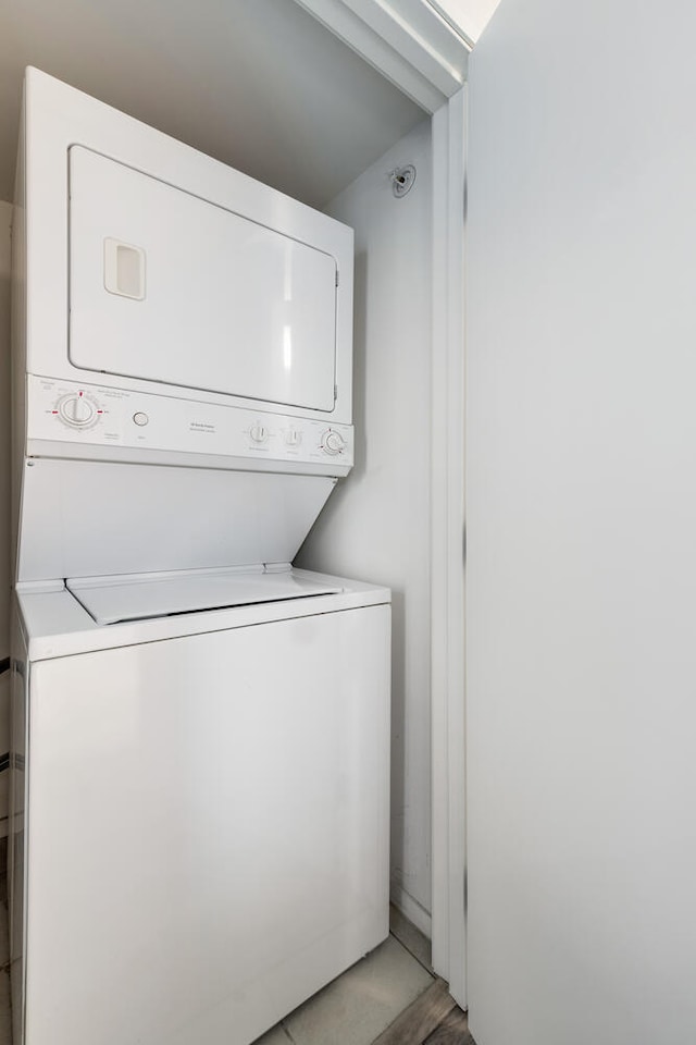 9715 Woods Dr Unit 700, Skokie, IL 60077 - washroom with stacked washer / dryer