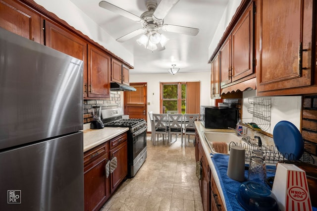 754 E 158th St, South Holland, IL 60473 - kitchen featuring stainless steel appliances, under cabinet range hood, a ceiling fan, light countertops, and decorative backsplash