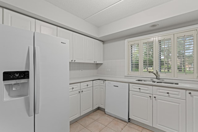 730 Creekside Dr Unit 104, Mount Prospect, IL 60056 - kitchen with white appliances, light countertops, white cabinetry, light tile patterned floors, and a textured ceiling