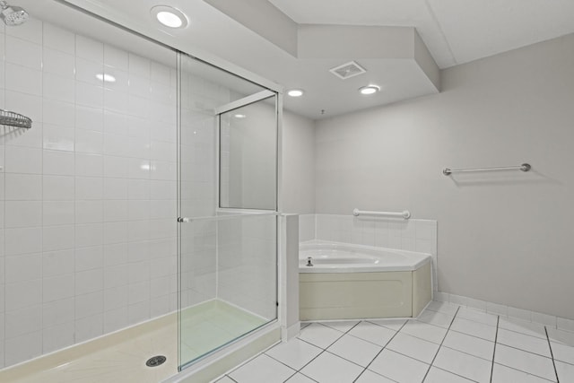 730 Creekside Dr Unit 104, Mount Prospect, IL 60056 - full bathroom featuring a shower stall, a bath, and tile patterned floors