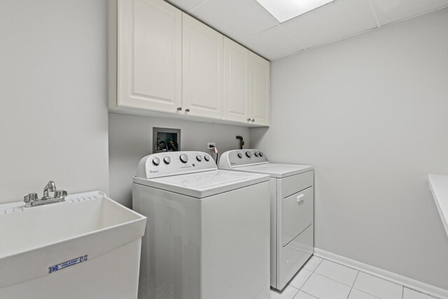 730 Creekside Dr Unit 104, Mount Prospect, IL 60056 - laundry room featuring cabinet space, washing machine and clothes dryer, and light tile patterned flooring