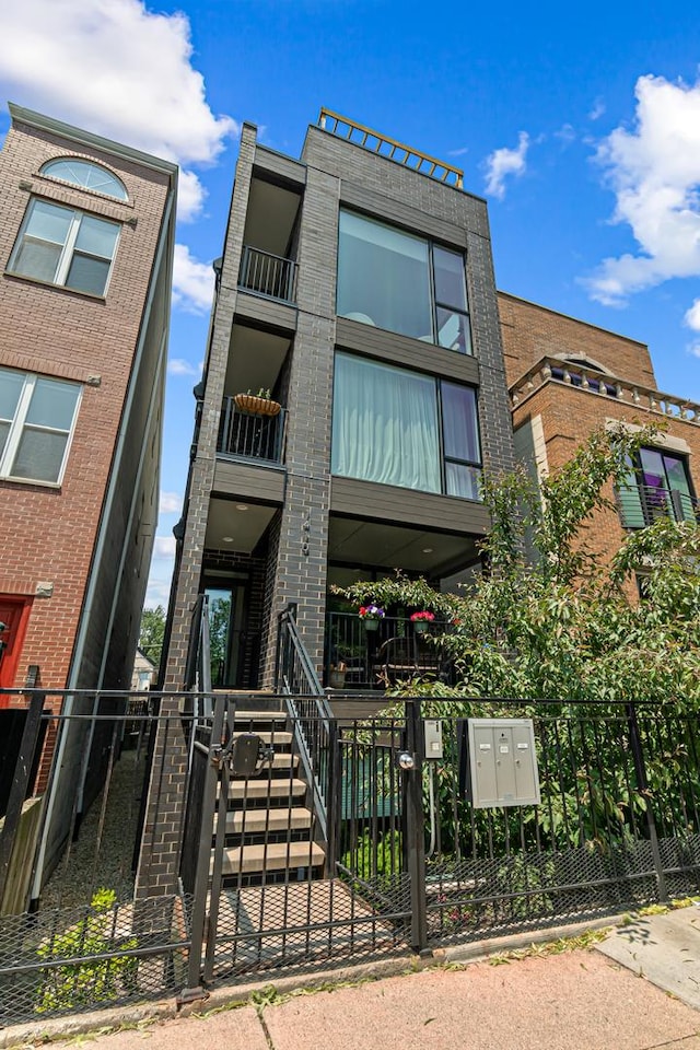 1410 N Greenview Ave Unit 1, Chicago, IL 60642 - view of building exterior with a fenced front yard