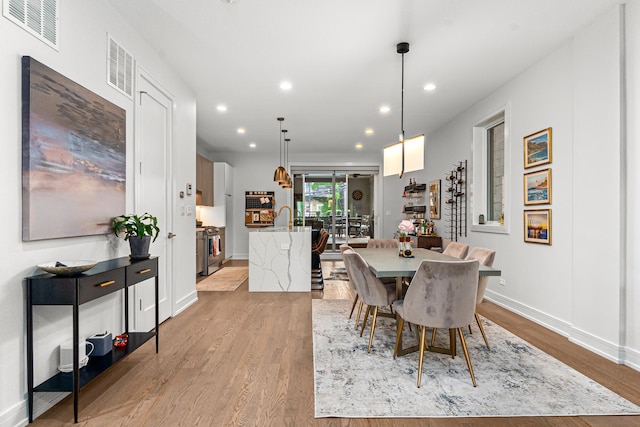 1410 N Greenview Ave Unit 1, Chicago, IL 60642 - dining room with recessed lighting and light wood-style floors