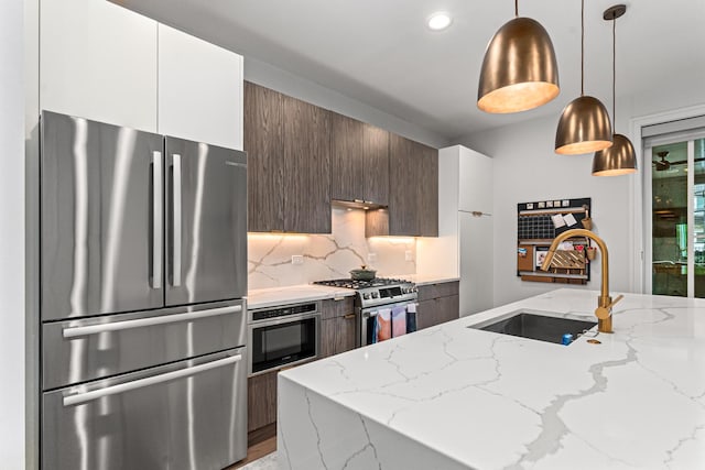1410 N Greenview Ave Unit 1, Chicago, IL 60642 - kitchen with stainless steel appliances, modern cabinets, decorative light fixtures, white cabinetry, and recessed lighting