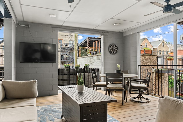 1410 N Greenview Ave Unit 1, Chicago, IL 60642 - living room featuring hardwood / wood-style floors, a ceiling fan, and concrete block wall