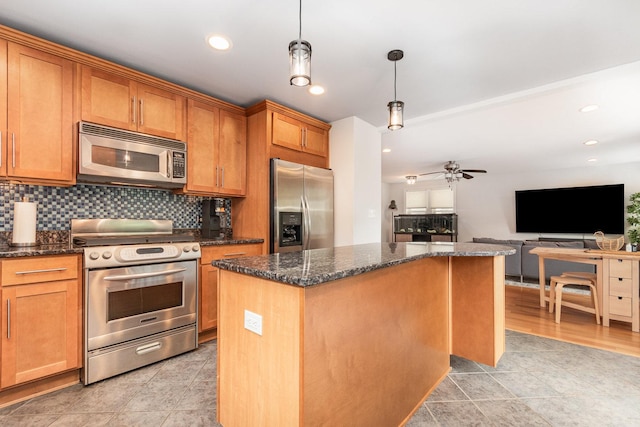1237 Fox River Dr, Algonquin, IL 60102 - kitchen with appliances with stainless steel finishes, a center island, ceiling fan, decorative backsplash, and open floor plan