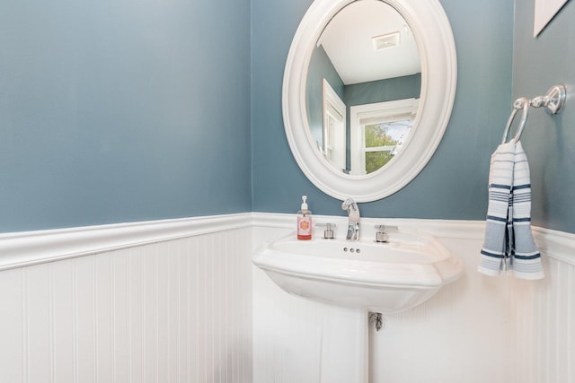 1237 Fox River Dr, Algonquin, IL 60102 - bathroom with wainscoting and a decorative wall