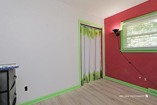 38159 N Geraghty Ave, Beach Park, IL 60087 - unfurnished bedroom featuring wood finished floors and a closet