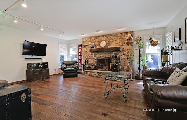 38159 N Geraghty Ave, Beach Park, IL 60087 - living room featuring track lighting, hardwood / wood-style flooring, and a stone fireplace