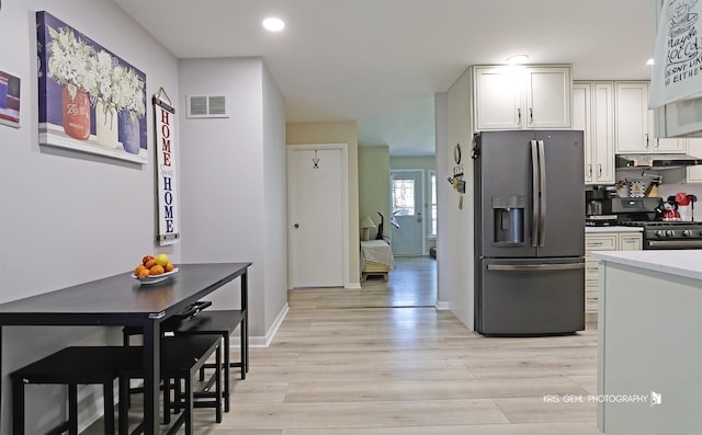 38159 N Geraghty Ave, Beach Park, IL 60087 - kitchen featuring stainless steel appliances, white cabinetry, light wood-style flooring, and recessed lighting