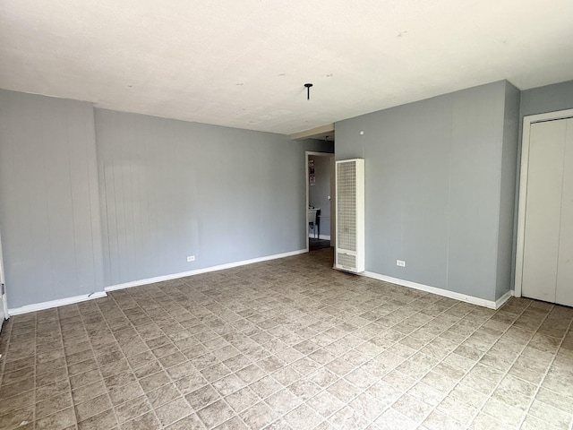 1133 Parkview Ave, Chicago Heights, IL 60411 - spare room featuring a heating unit and baseboards