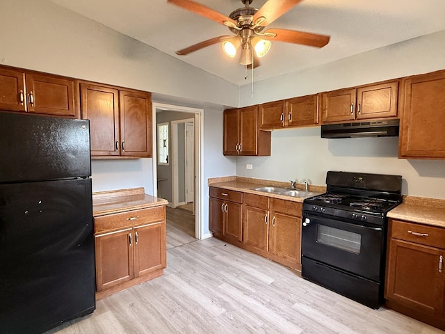 1133 Parkview Ave, Chicago Heights, IL 60411 - kitchen featuring black appliances, under cabinet range hood, vaulted ceiling, light wood-style floors, and a ceiling fan