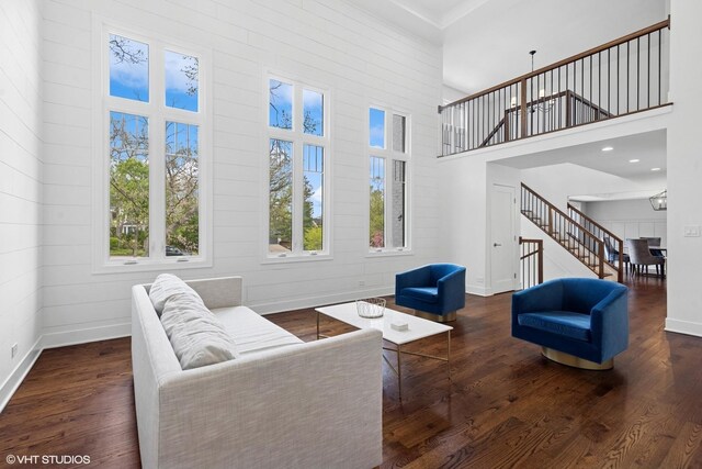 16 W Birchwood Ave, Hinsdale, IL 60521 - living room featuring stairway, wood finished floors, baseboards, and a towering ceiling