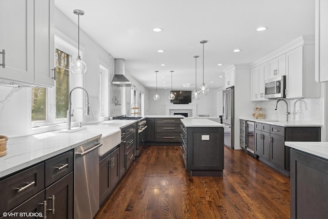 16 W Birchwood Ave, Hinsdale, IL 60521 - kitchen with stainless steel appliances, recessed lighting, white cabinetry, tasteful backsplash, and a sink