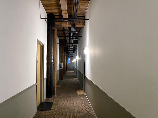 1250 W Van Buren St Unit 202, Chicago, IL 60607 - corridor featuring a high ceiling, dark carpet, and beamed ceiling