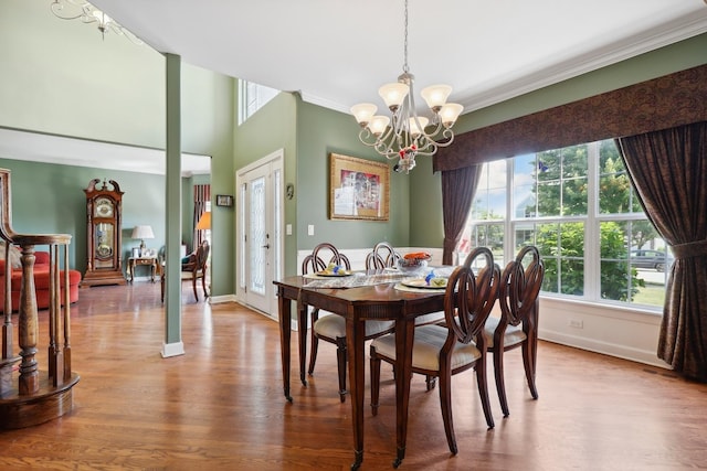 12820 Tipperary Ln, Plainfield, IL 60585 - dining area with a chandelier, wood finished floors, and ornamental molding