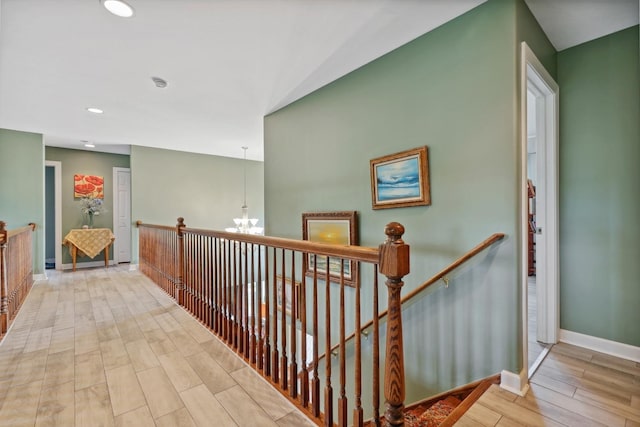 12820 Tipperary Ln, Plainfield, IL 60585 - corridor with a chandelier, wood finished floors, an upstairs landing, and recessed lighting
