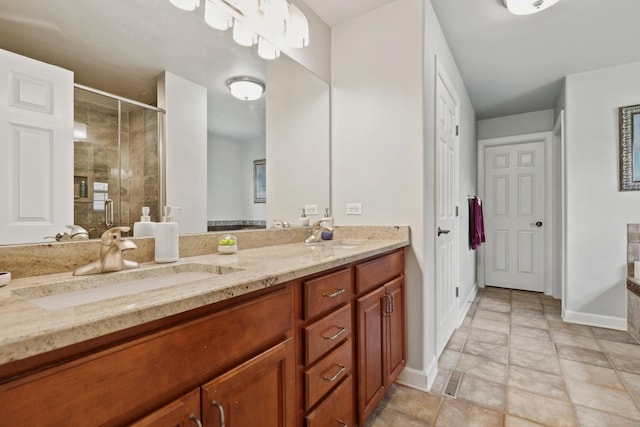 12820 Tipperary Ln, Plainfield, IL 60585 - bathroom featuring double vanity, a shower stall, and stone finish floors