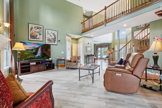 12820 Tipperary Ln, Plainfield, IL 60585 - living area with a towering ceiling, stairs, and recessed lighting