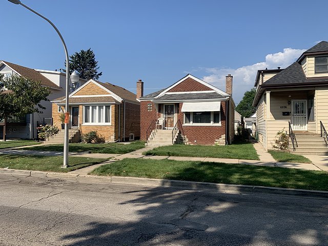 6210 S Keeler Ave, Chicago, IL 60629 - bungalow-style home featuring brick siding and a front yard