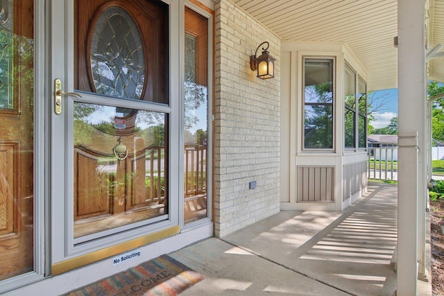 3760 N Alder Dr, Hoffman Estates, IL 60192 - doorway to property with brick siding and covered porch