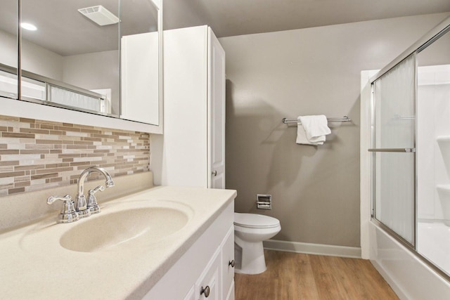 3760 N Alder Dr, Hoffman Estates, IL 60192 - full bathroom featuring tasteful backsplash, vanity, wood finished floors, and combined bath / shower with glass door
