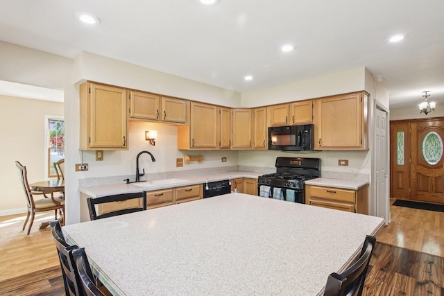 3760 N Alder Dr, Hoffman Estates, IL 60192 - kitchen with black appliances, light countertops, dark wood-style floors, and recessed lighting