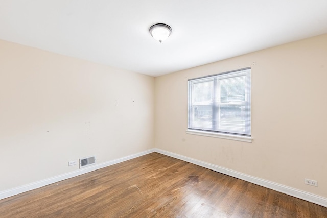 9626 S Oglesby Ave, Chicago, IL 60617 - spare room featuring wood finished floors