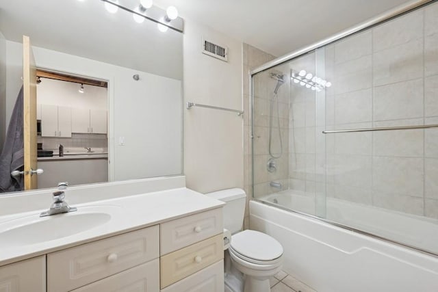 420 S Clinton St Unit 614A, Chicago, IL 60607 - bathroom featuring toilet, vanity, enclosed tub / shower combo, and tile patterned flooring
