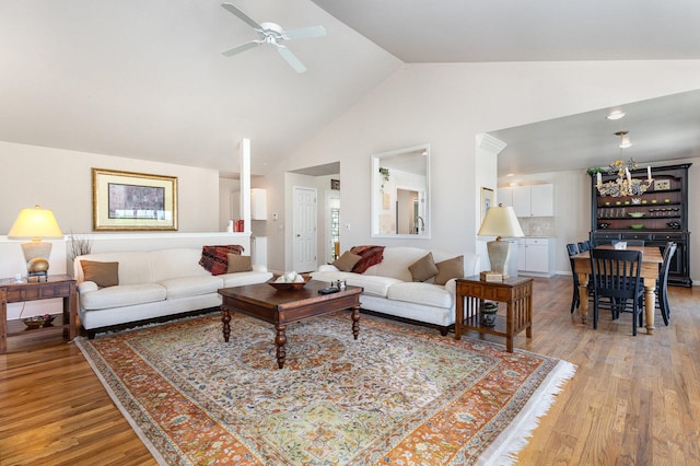 5284 Harvey Rd, Caledonia, IL 61011 - living area with high vaulted ceiling, ceiling fan, and wood finished floors