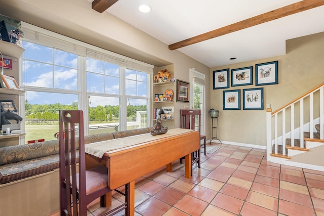 5284 Harvey Rd, Caledonia, IL 61011 - dining space with beam ceiling, stairs, and light tile patterned floors