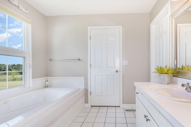 5284 Harvey Rd, Caledonia, IL 61011 - full bath with vanity, a bath, plenty of natural light, and tile patterned flooring